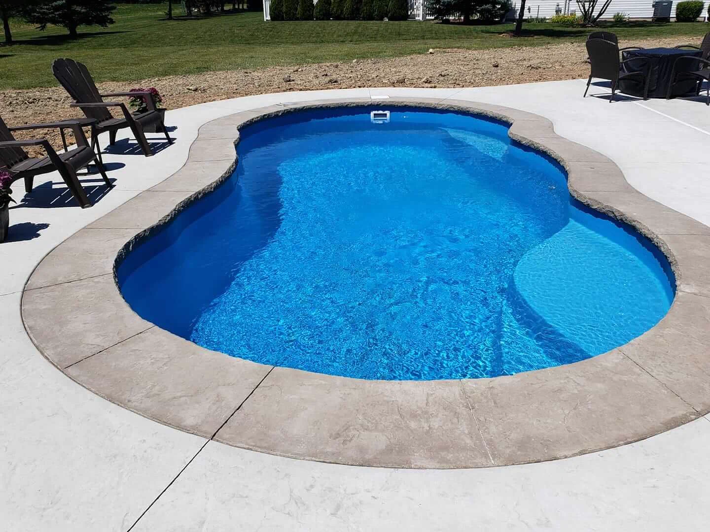 Clean fiberglass pool with clear water