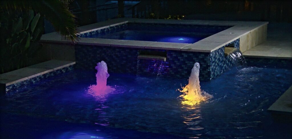 Purple and Yellow Pool Lights at nigh in San Juan Pool